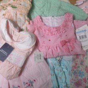 box full of girls outfits, dresses and jumpers